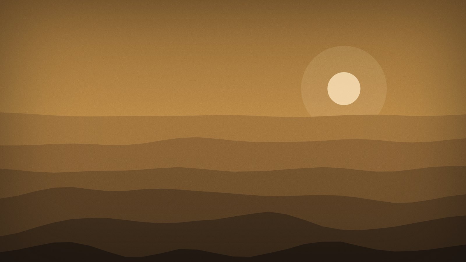Low sun over a series of receding ridges at dusk